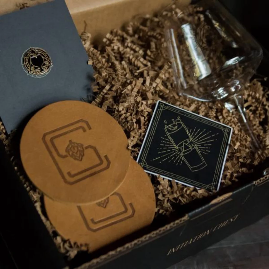 Craft subscription box with leather pieces and project accessories.