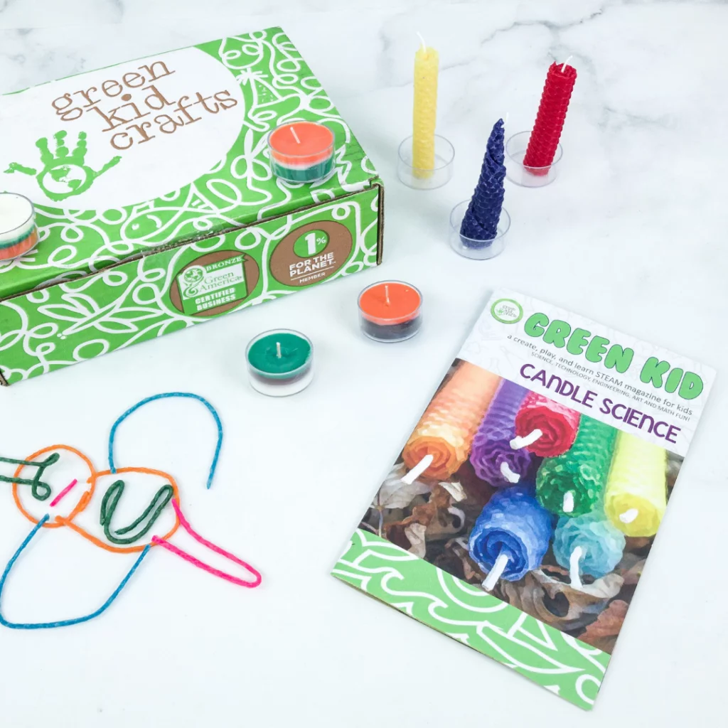 Green Kid Crafts box with candle-making and science activity materials.