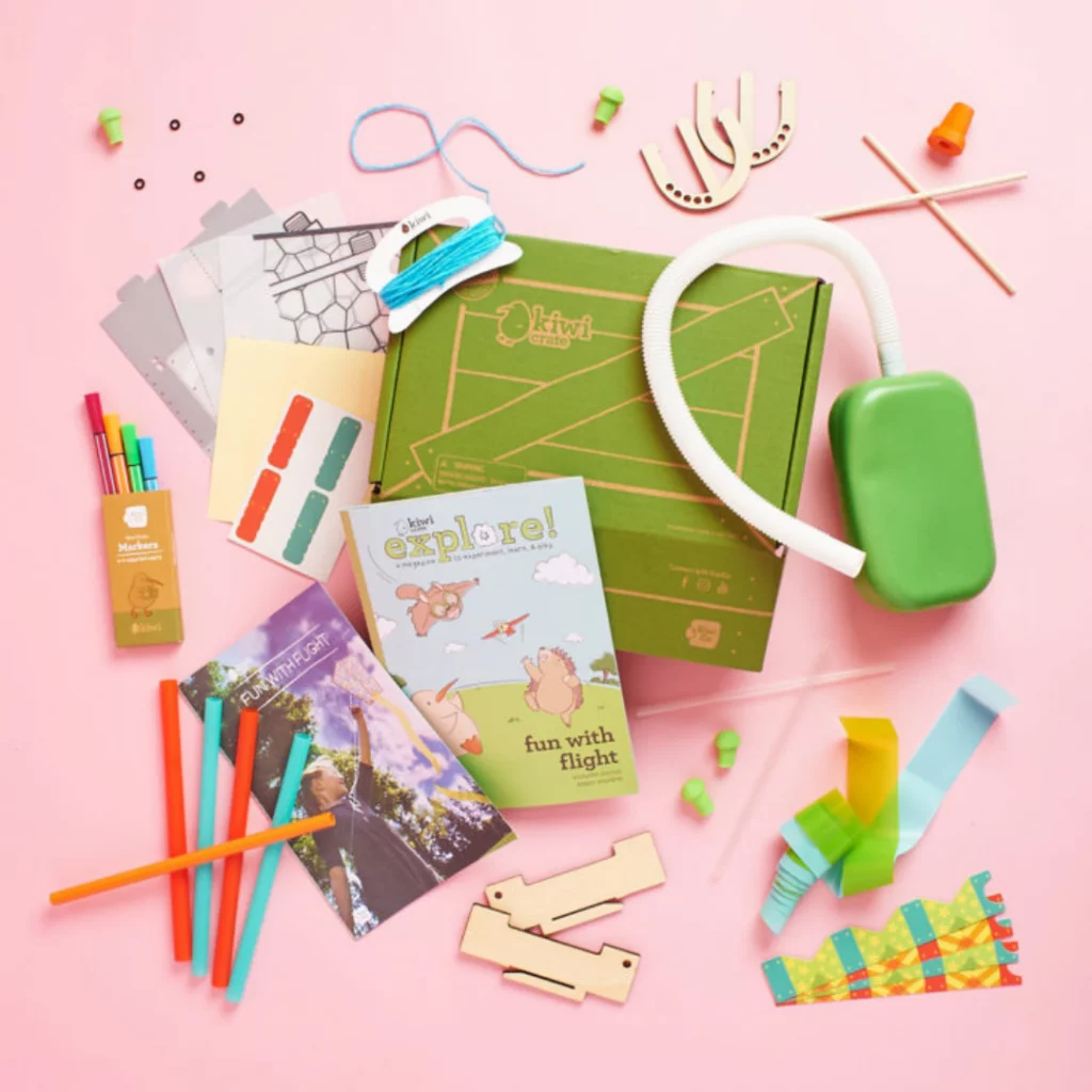 Craft subscription supplies, including paper, embroidery materials and small tools.