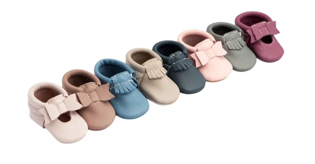 Baby shoes in several colors shown as a product example.