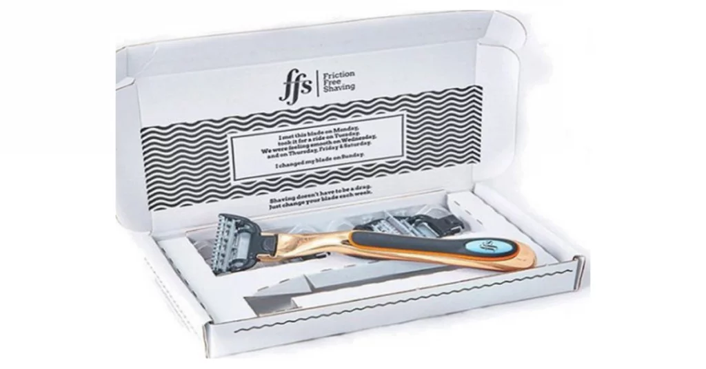Friction Free Shaving box with a razor and replacement blades.