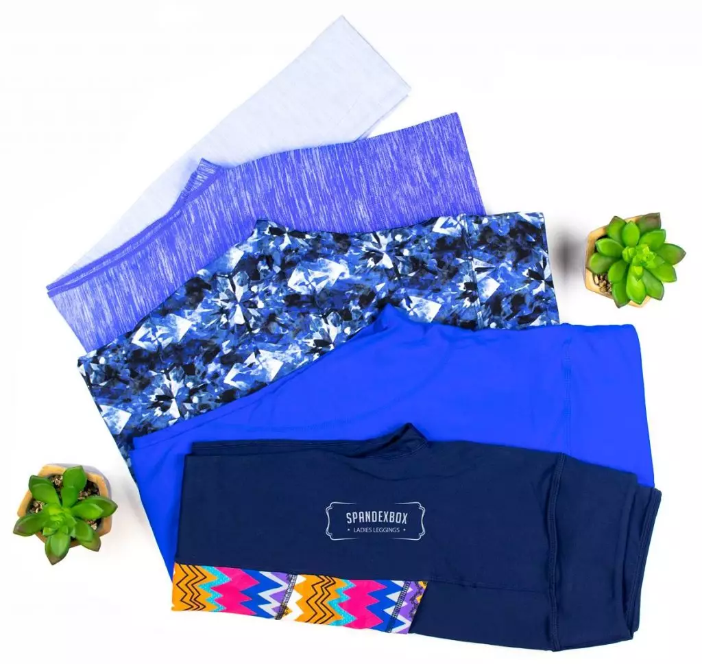 Folded workout leggings in blue and purple patterns.